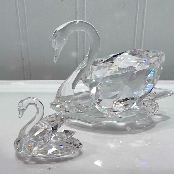 Two Swarovski Crystal swans. Medium and small.